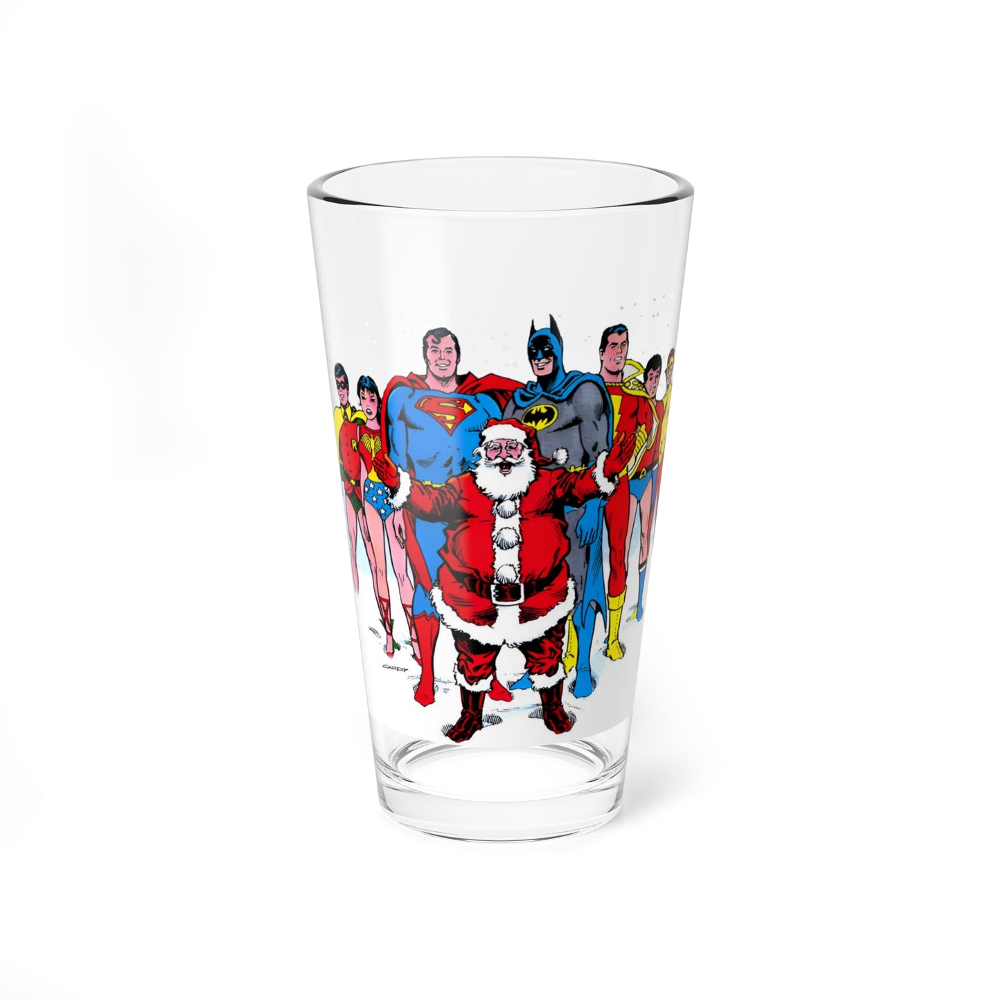Clear pint glass with Superman, Batman, and Santa design on a white background