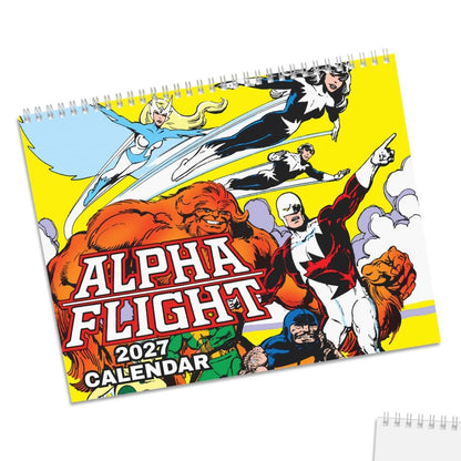 Two spiral-bound 2027 Alpha Flight calendar pages shown on a white background, with one page displaying the colorful comic-style cover art and the other showing a blank white interior with a small printed corner label.