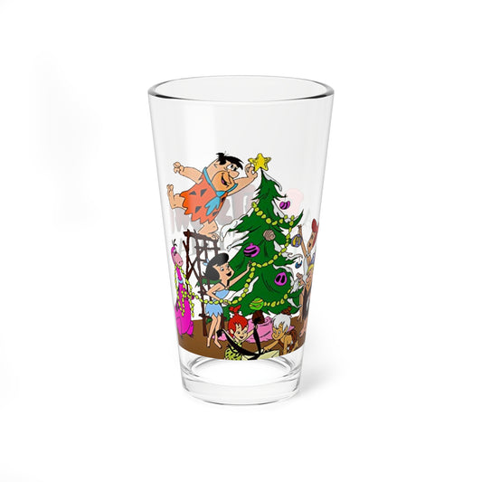 Clear pint glass with cartoon design of The Flintstones decorating a Christmas tree on a white background